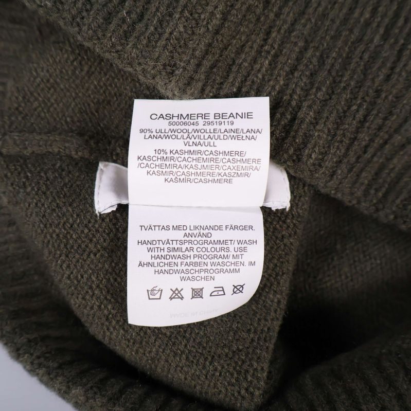 Materiallapp i mössa visar ull och kashmir