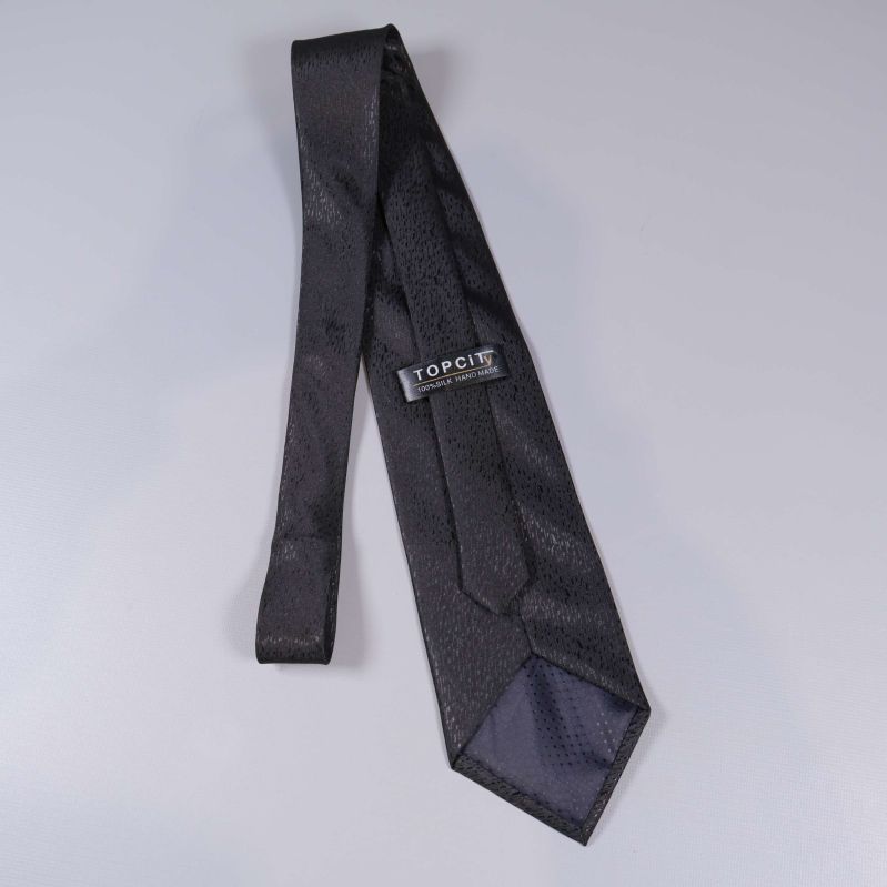 Baksida slips med Topcity-märke synligt