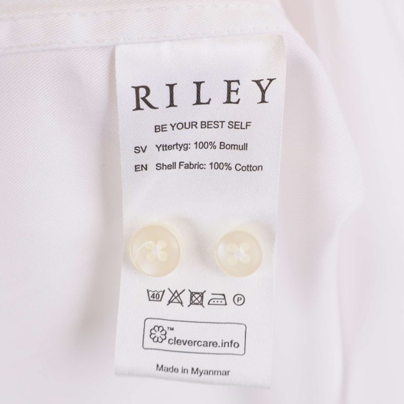 Materiallapp visar Riley, instruktioner och 100% bomull