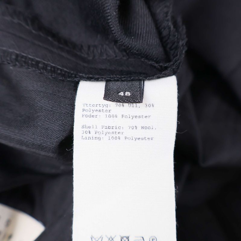 Materiallapp med information om ull och polyester