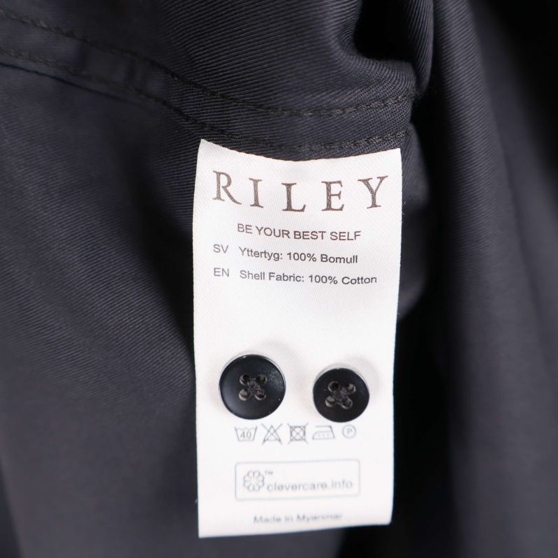 Materiallapp visar 100% bomull och extraknappar