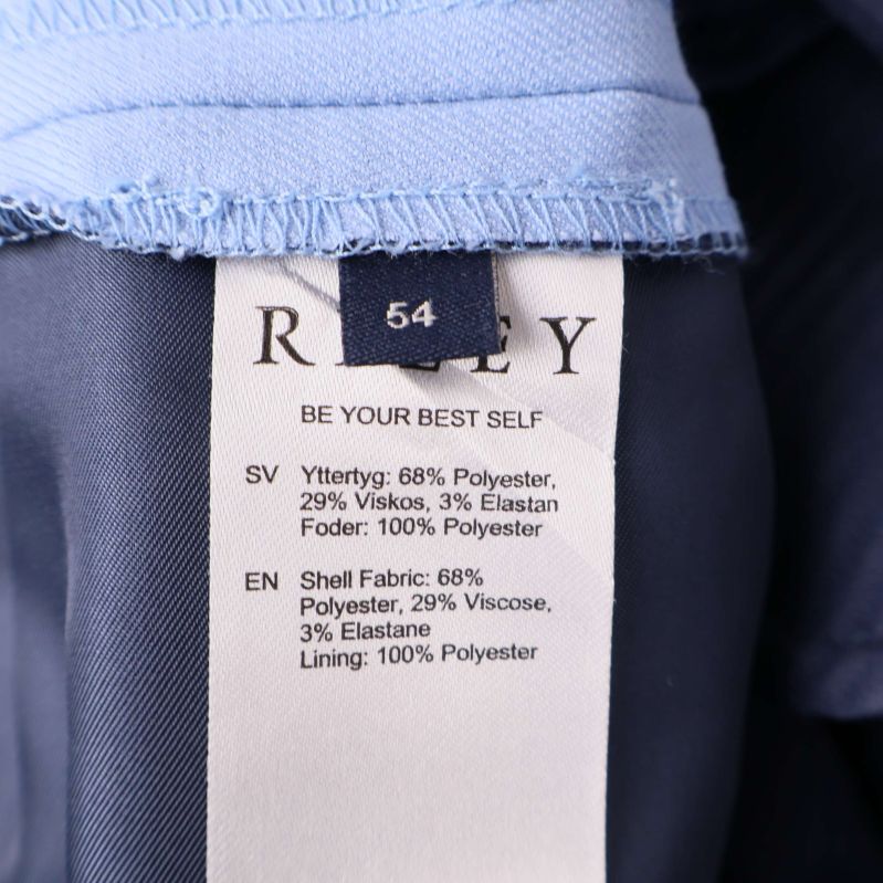 Materiallapp visar sammansättning: polyester, viskos, elastan