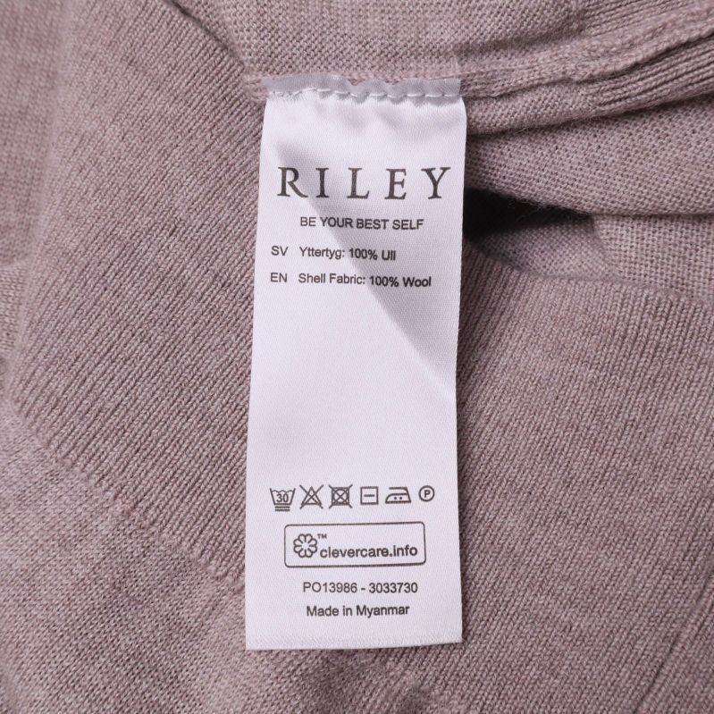 Tvätt- och materialetikett med 100 procent ulltext