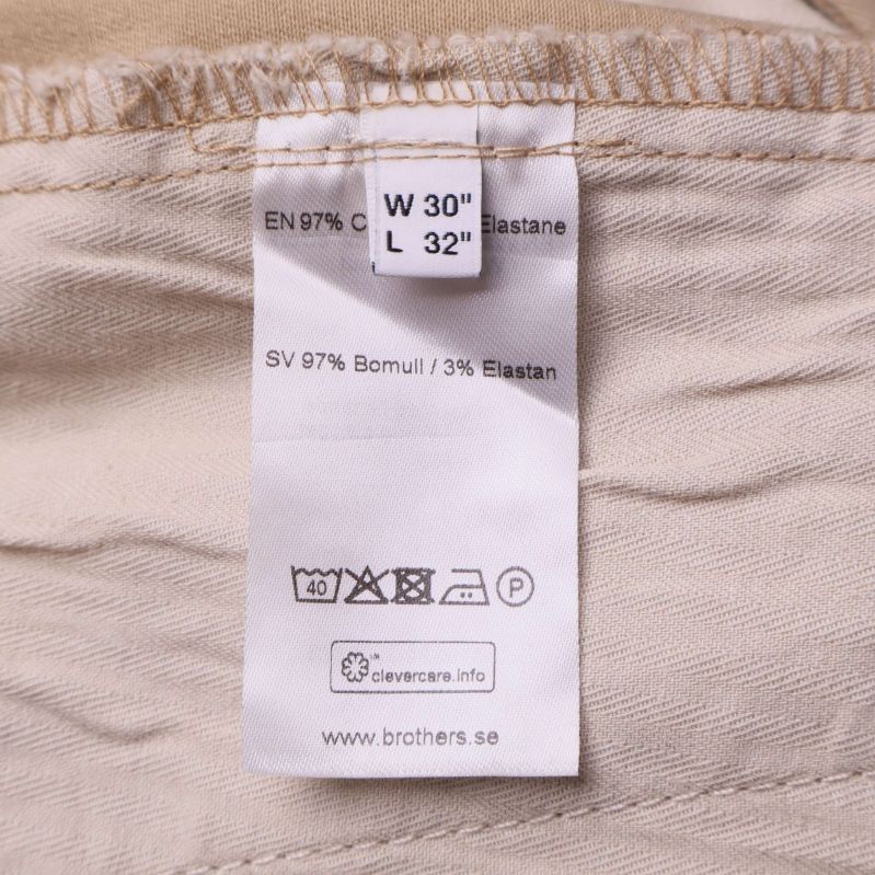 Materiallapp med information 97% bomull och 3% elastan