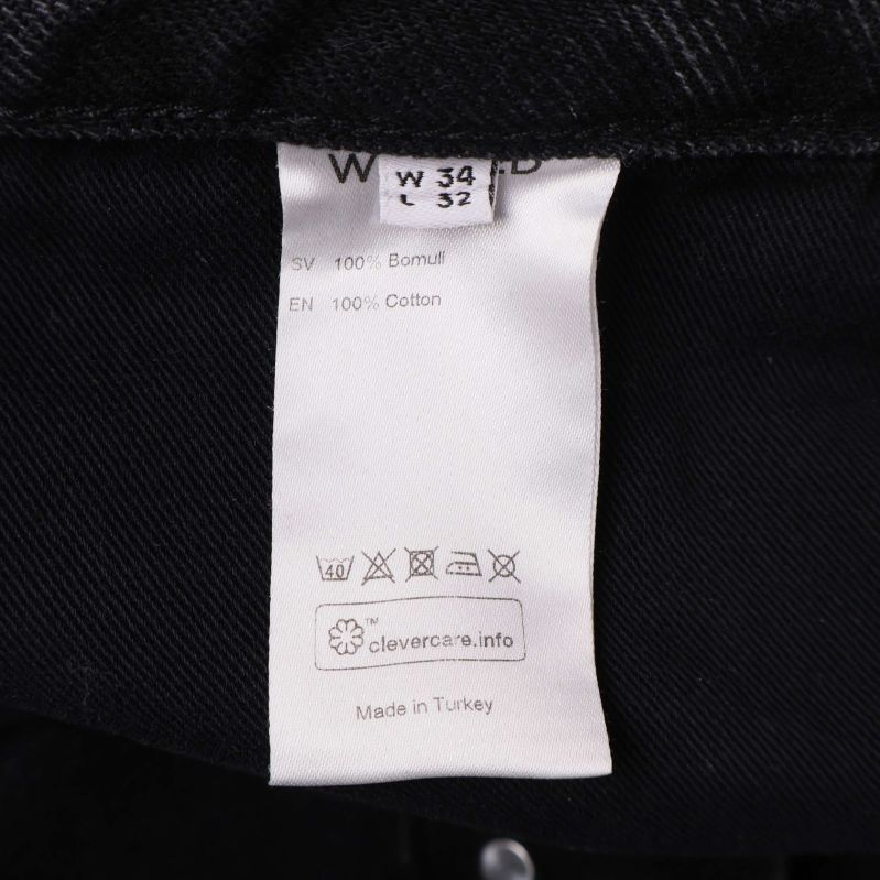 Tvättrådslapp med materialinformation 100% bomull, jeans storlek W34 L32