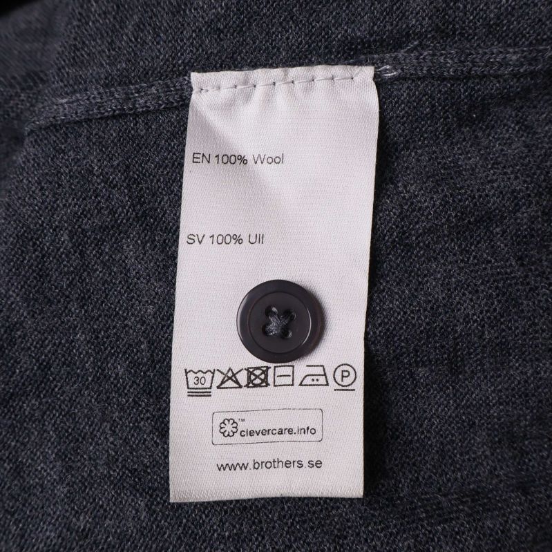 Materialetikett med 100% ull och tvättråd