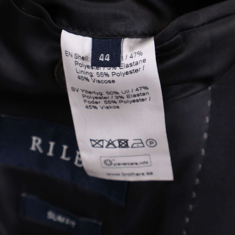 Materiallapp som visar tygblandning och tvättråd