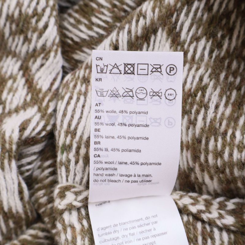 Materiallapp med sammansättning: 55% ull, 45% polyamid