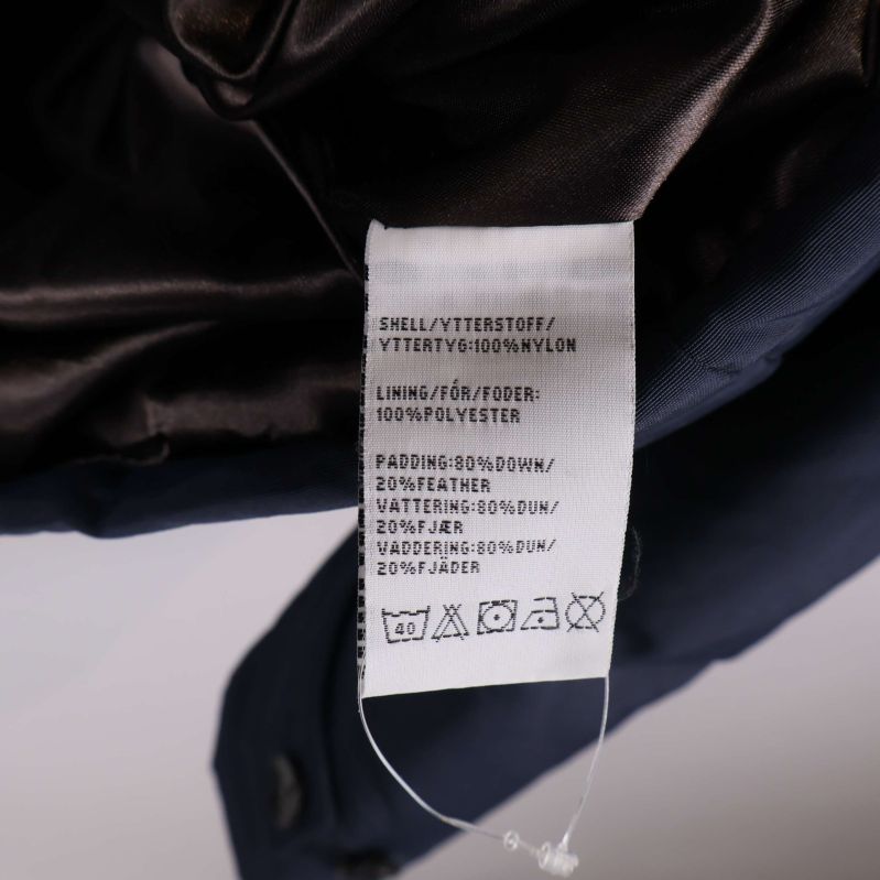 Materiallapp med sammansättning i jackans innerfoder