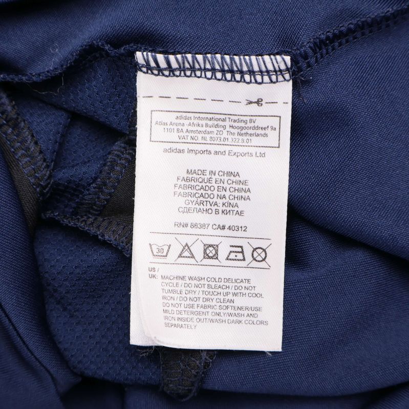 Tvättrådsetikett med skötsel- och materialinformation