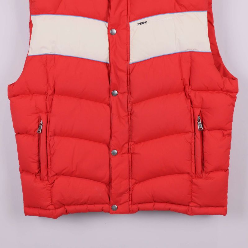 Nederdel av väst med dragkedjefickor synliga