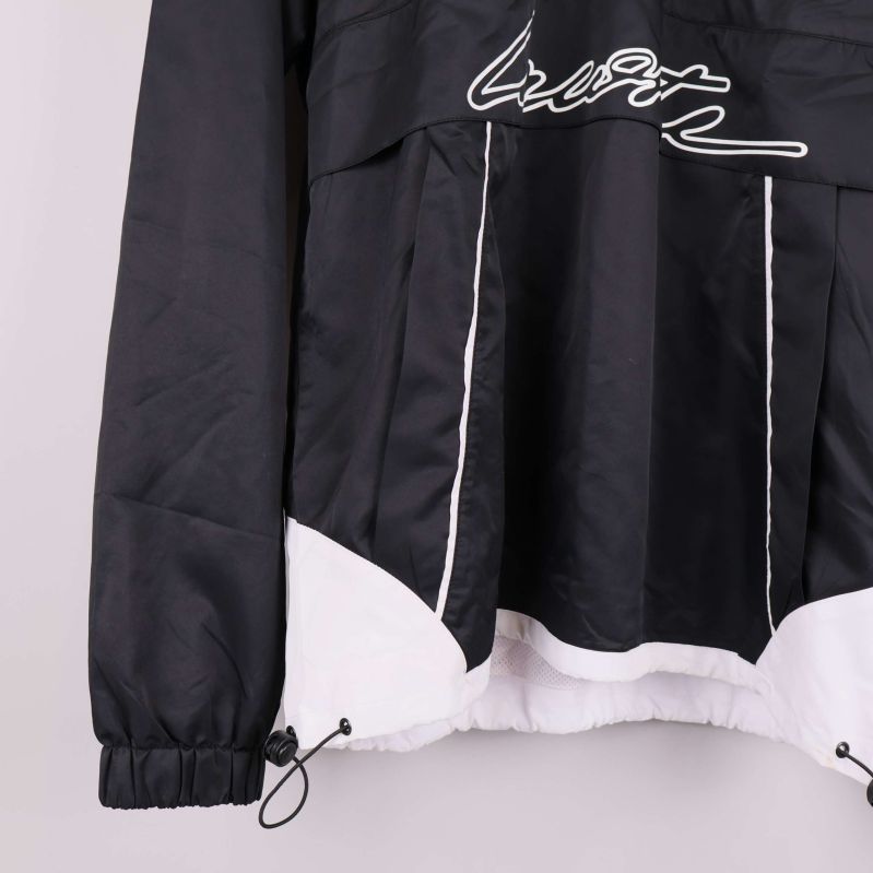 Nederdel av jackan visar dragsko och vit sektion