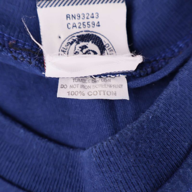 Materiallapp som visar 100% bomull