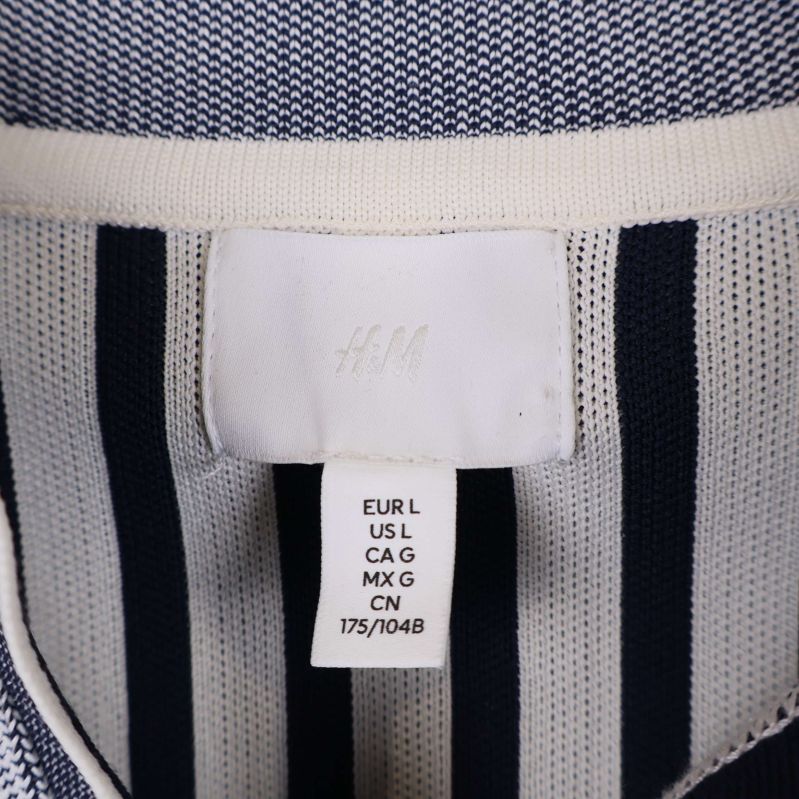 Närbild på etikett som visar storlek L från H&M