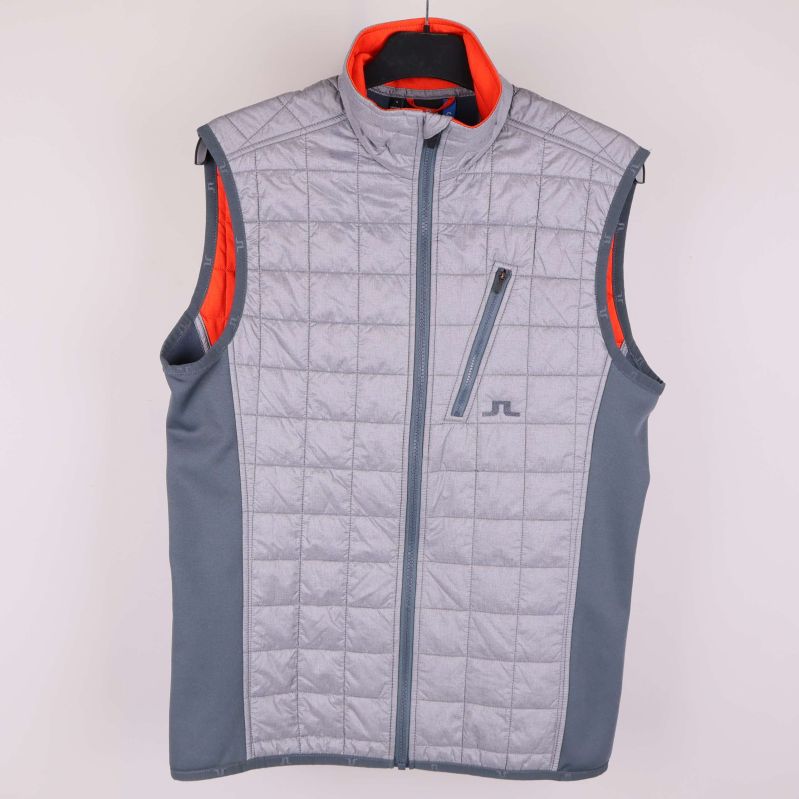 Grå quiltad väst med kontrastfärg och dragkedja framtill