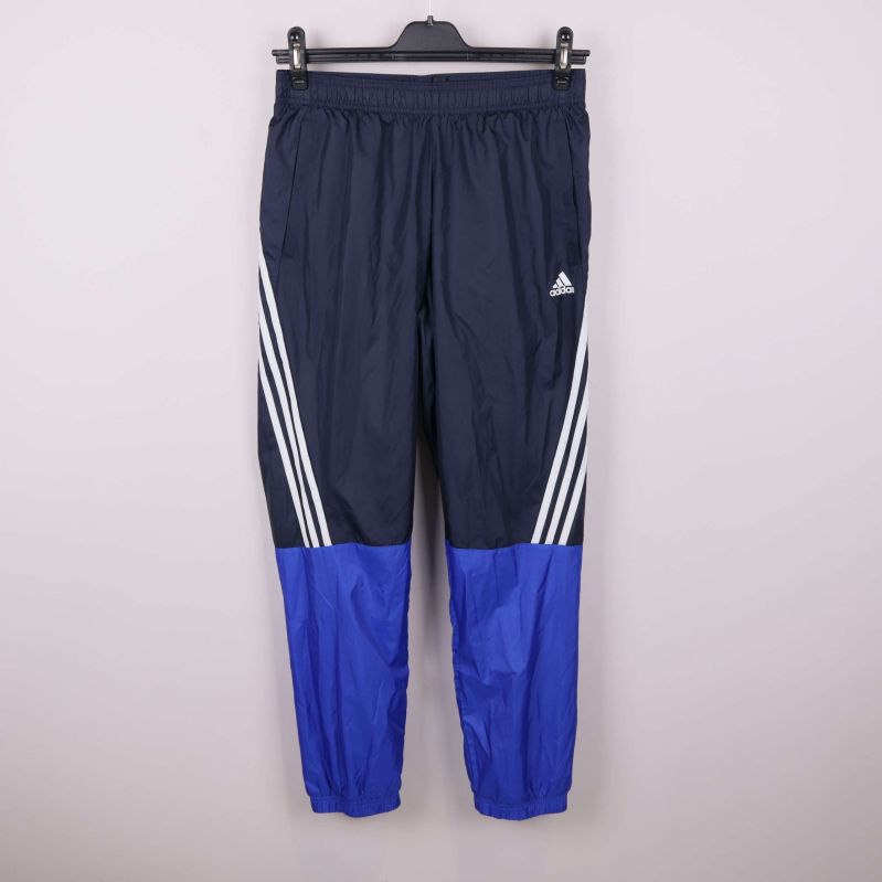 Mörkblå träningsbyxor med vita ränder och blå färgblock