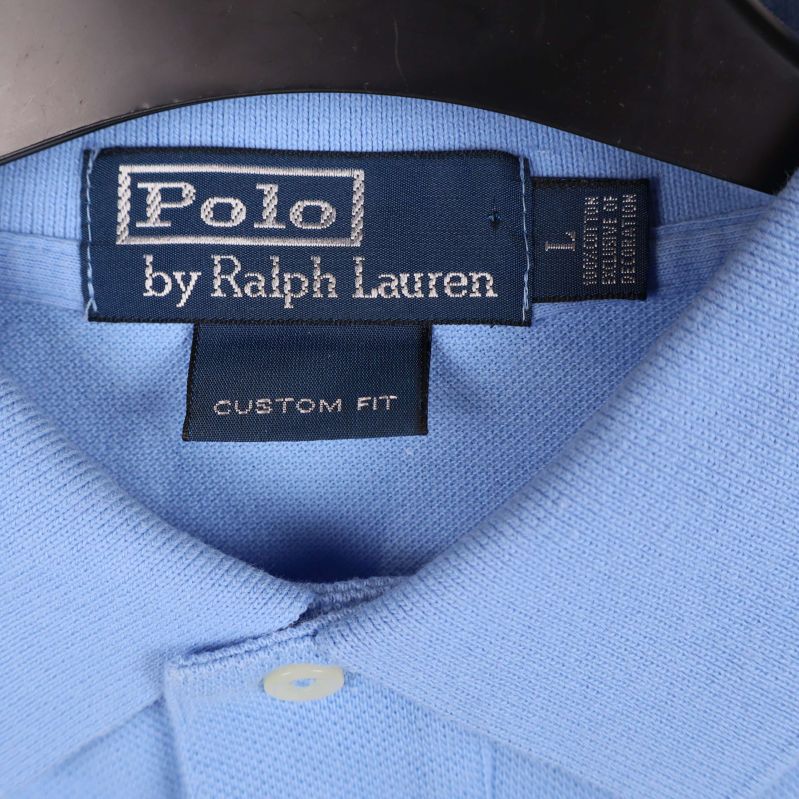 Etikett med Polo by Ralph Lauren logga och storlek L