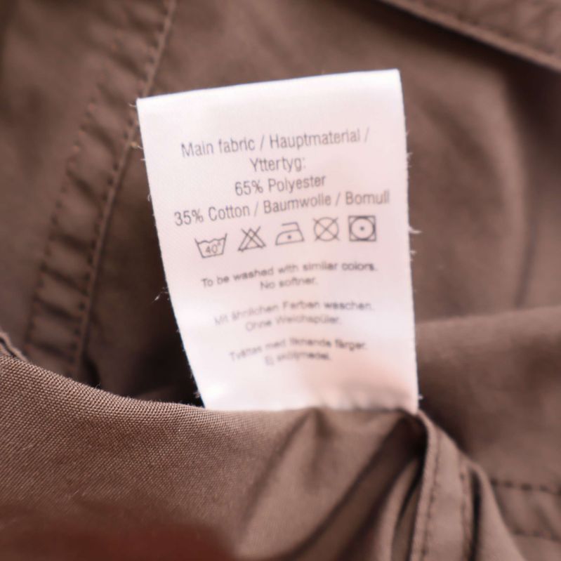 Materialetikett visar 65% polyester och 35% bomull