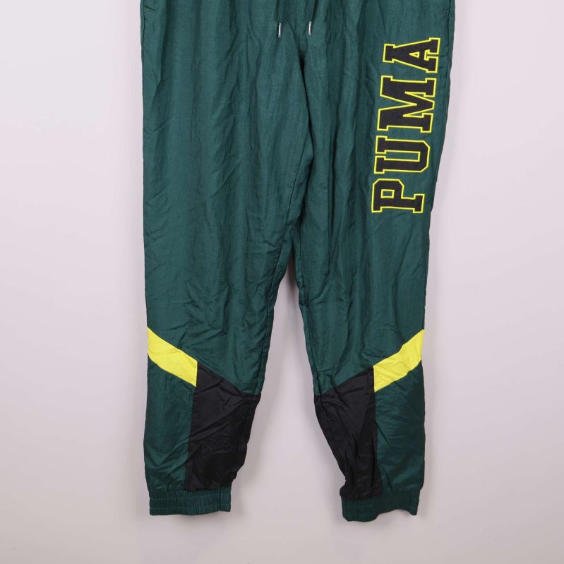 Nederdel av gröna byxor med gula och svarta partier