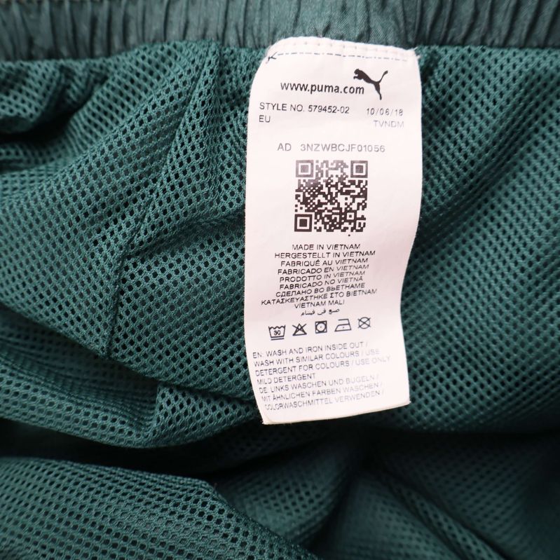 Tvättrådsetikett med tillverkningsinformation från PUMA