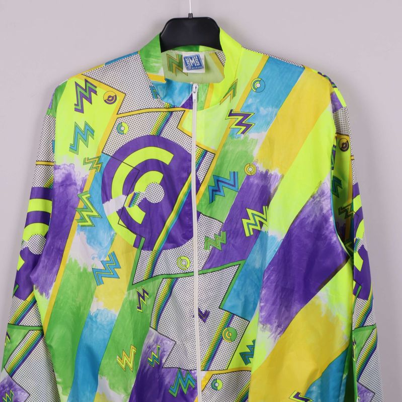 Övre del av jackan med dragkedja och färgglatt mönster