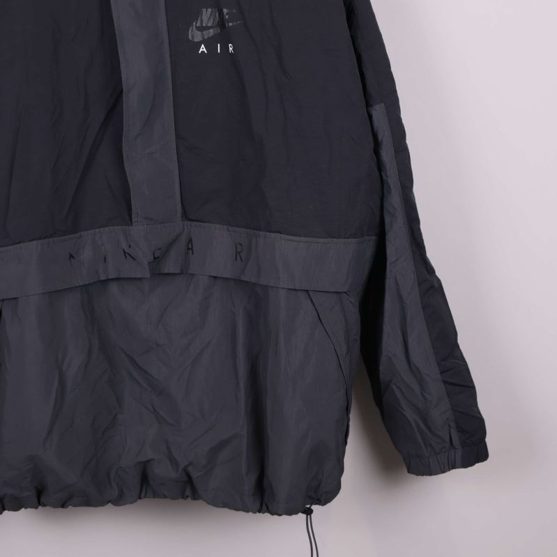 Nederdel av vindjacka med dragsko och kontrasterande partier