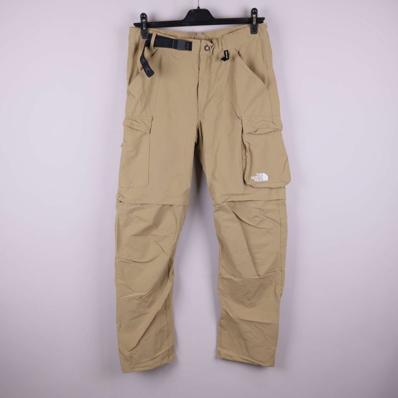 Beige friluftsbyxa med zip-off funktion och flera fickor