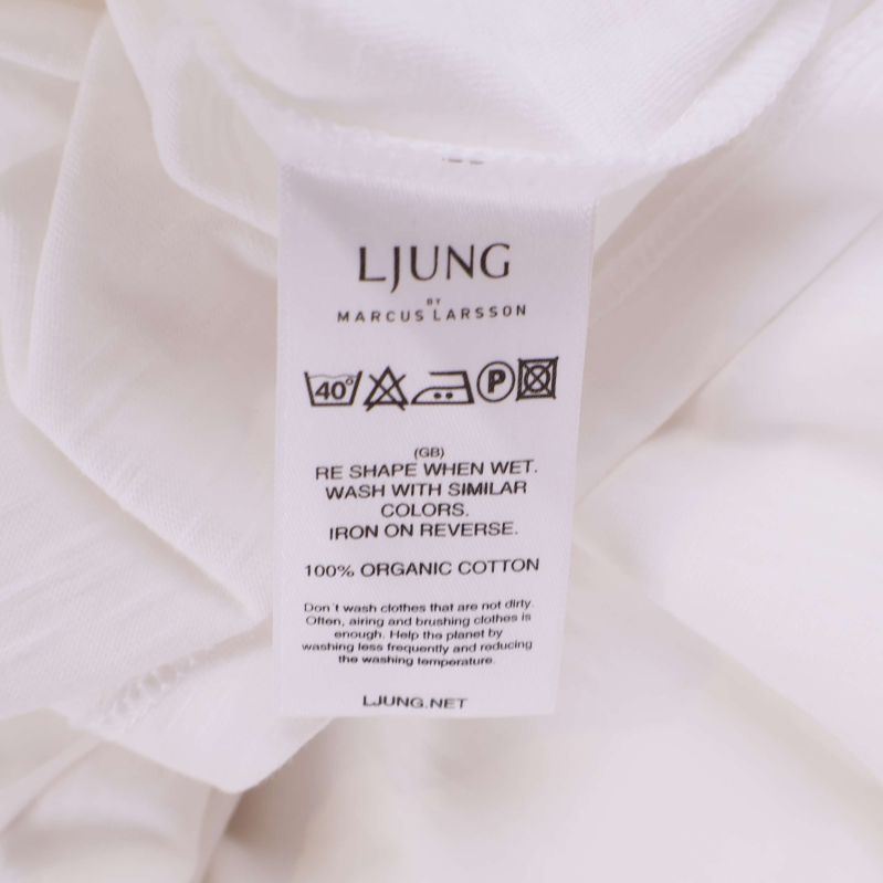 Tvättlapp med information om 100 procent bomull