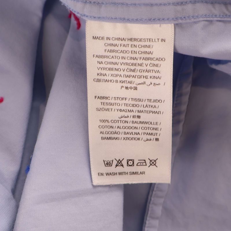 Materiallapp i skjortan anger 100% bomull