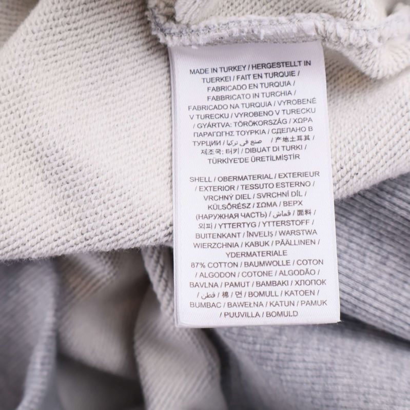 Materiallapp visar 87 procent bomull 13 procent polyester