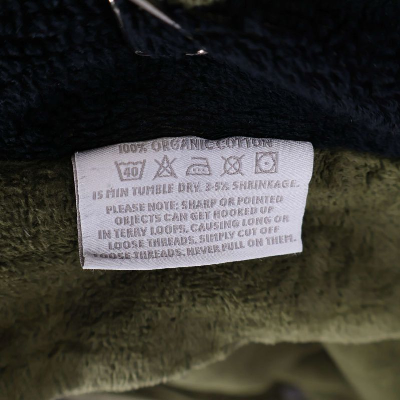 Tvättrådsetikett med materialinformationen 100% bomull