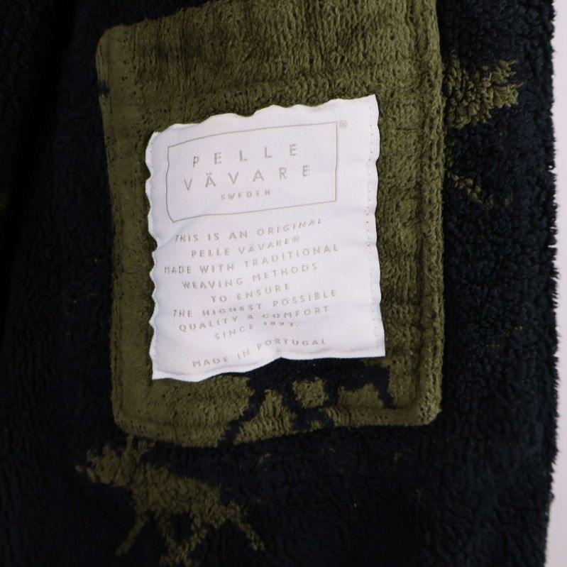 Inneretikett med detaljerad Pelle Vävare text