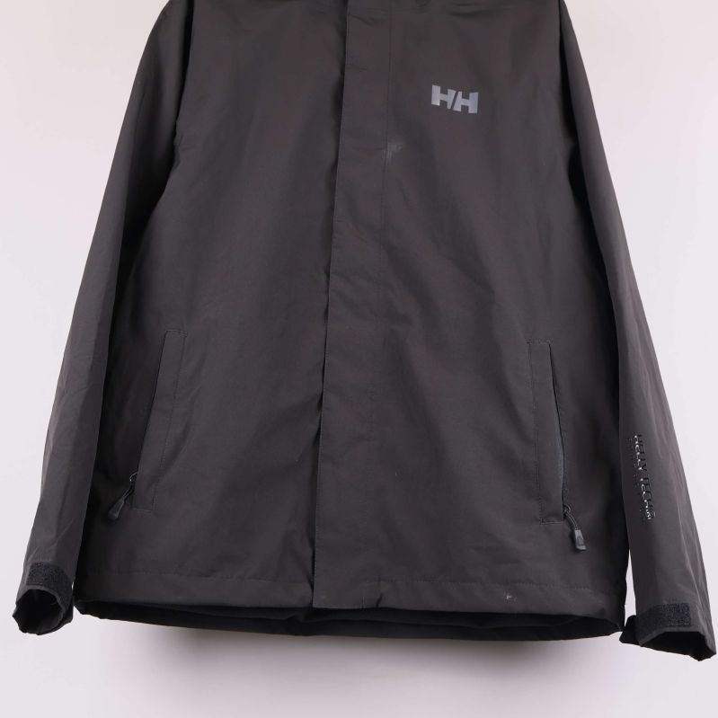 Nedre del av jacka med fickor och dragkedjor