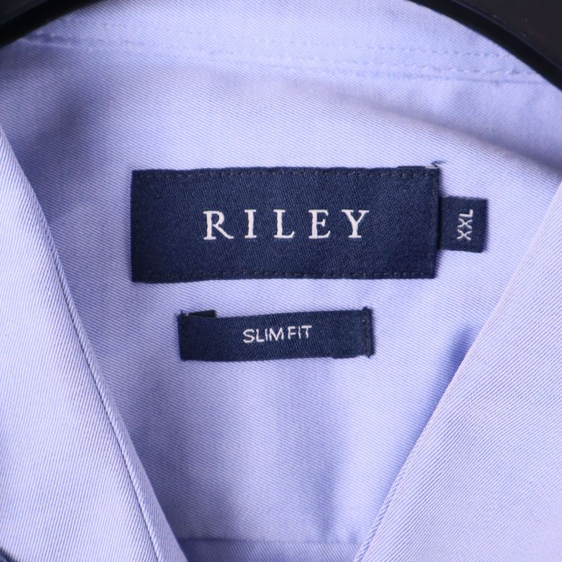 Etikett med Riley logotyp och storlek XXL