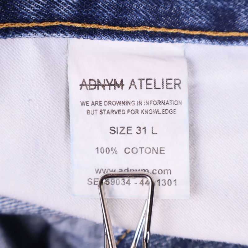 Materialetikett med adnym atelier, storlek 31 L och 100% bomull