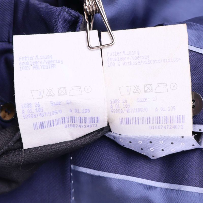 Materialetiketter visar 100% ull och 100% polyester