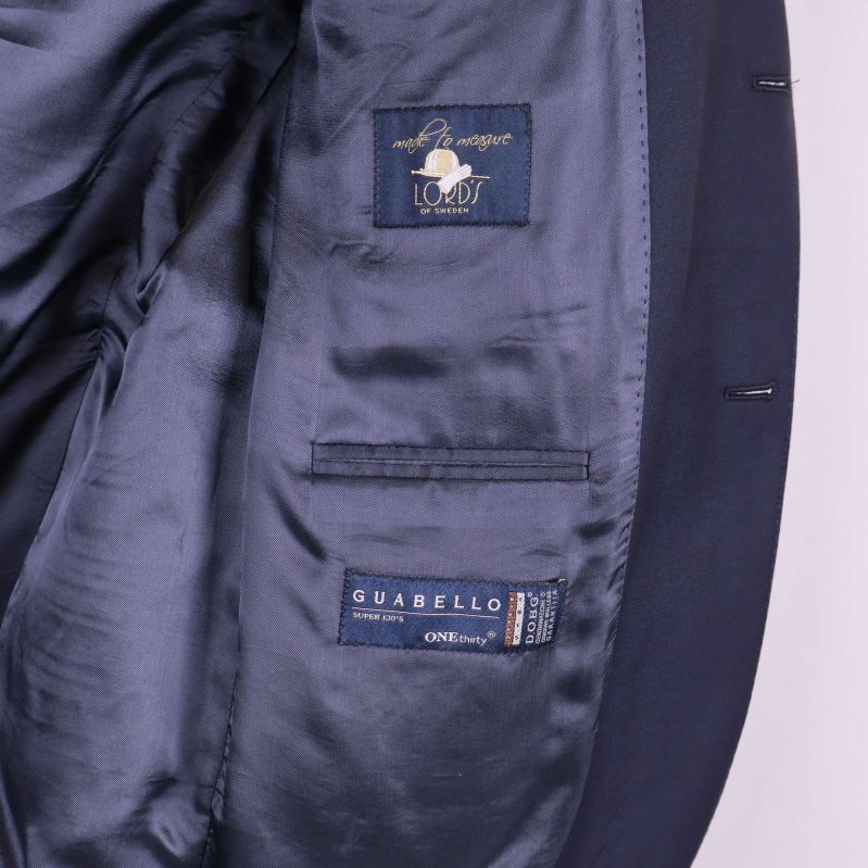 Kavajfoder och insida med Guabello och Lord-logga synlig