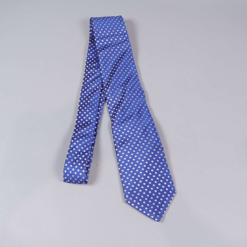 Slips i blått med vita prickar, liggande utvikt