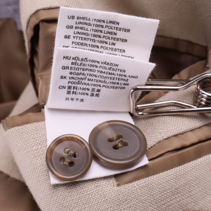 Tvättrådsetikett visar material i lin och polyester