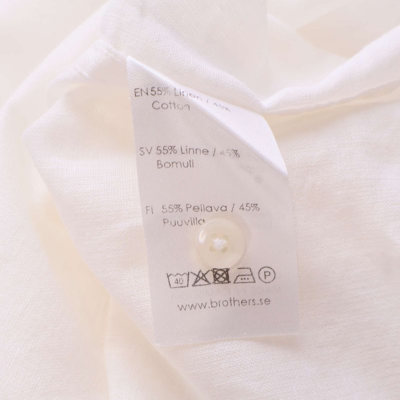 Materiallapp visar 55% linne och 45% bomull