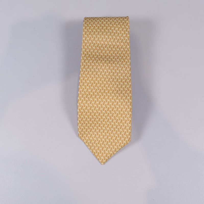 Framsidan av slips med beige geometriskt mönster