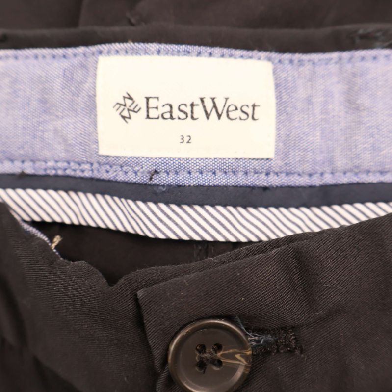 EastWest-logga och storleksetikett i midjan