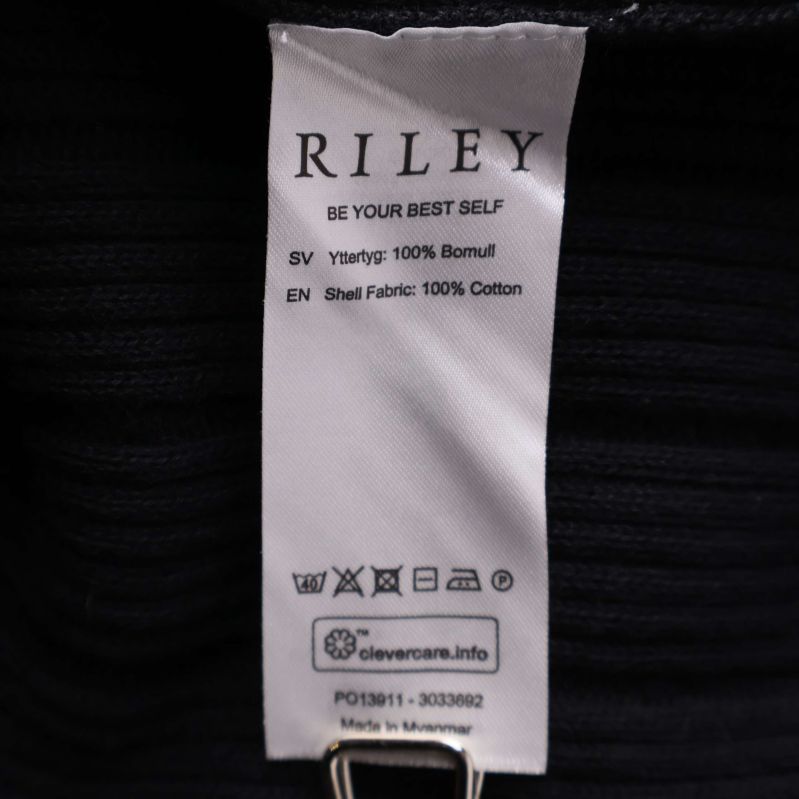 Materiallapp visar 100 procent bomull från RILEY