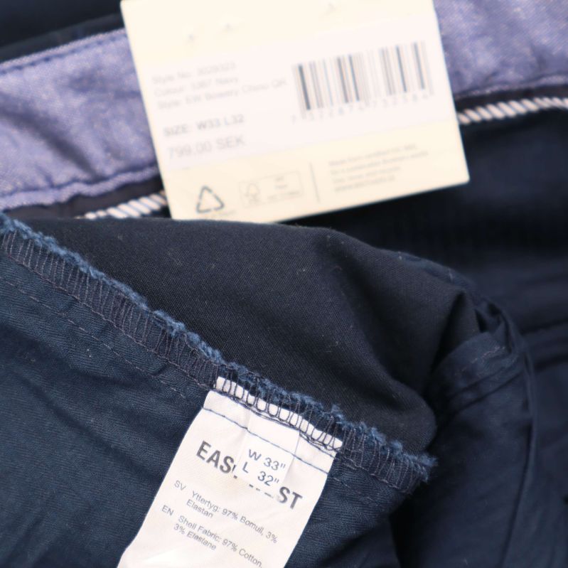 Materiallapp visar 98 procent bomull 2 procent elastan