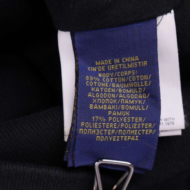 Materiallapp visar 83% bomull och 17% polyester