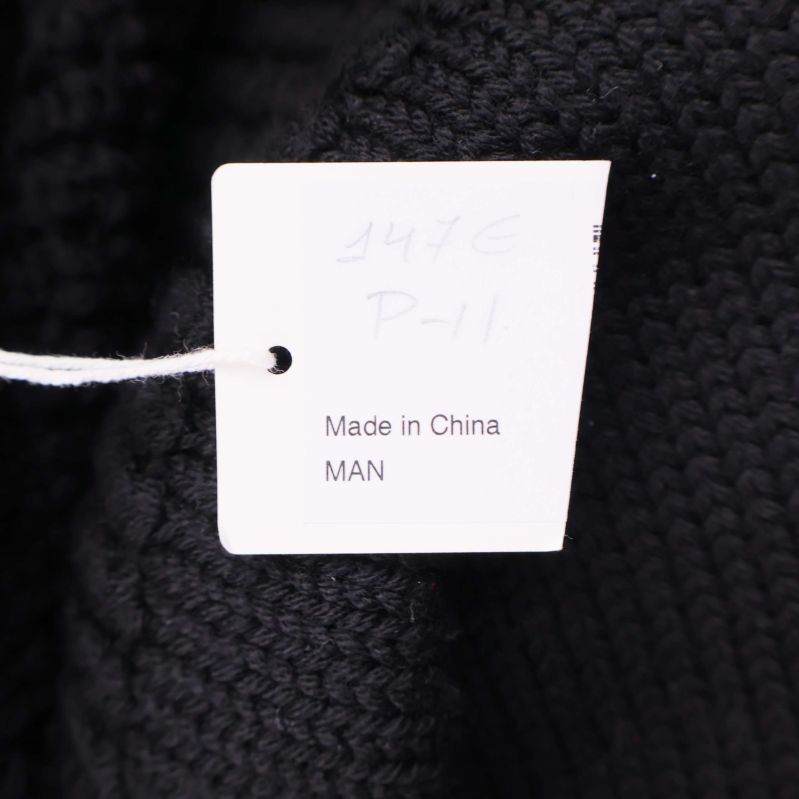 Liten etikett med text made in China MAN