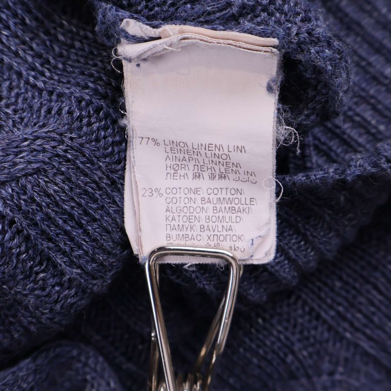 Materiallapp med texten 77% lin, 23% bomull