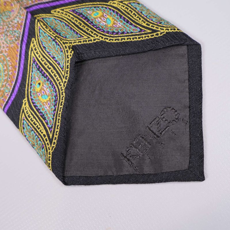 Slipsens spets med broderad Kenzo-text på tyget