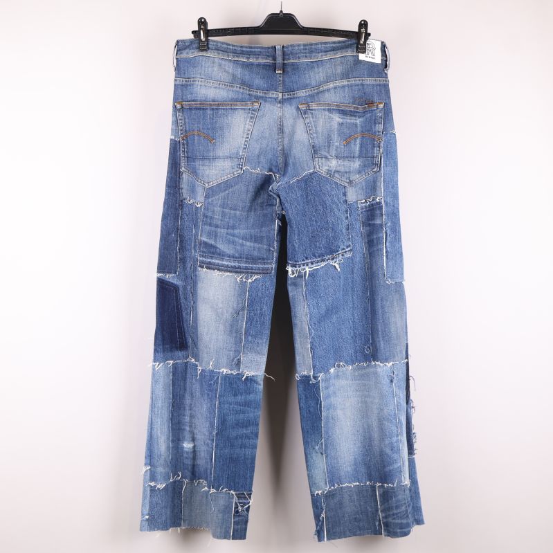 Baksida av patch jeans