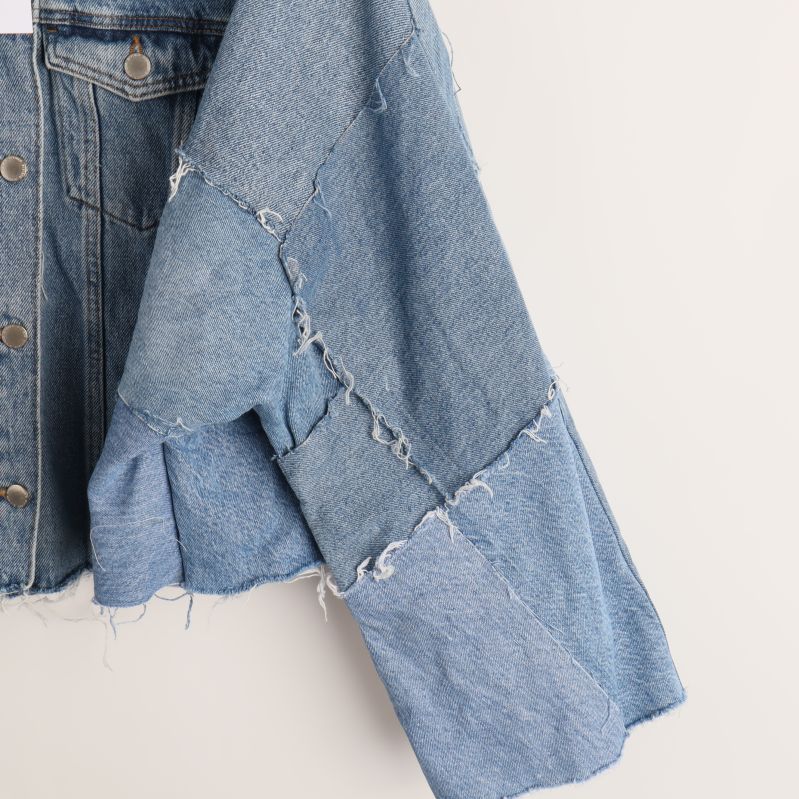 Sidan av ärm med patchwork